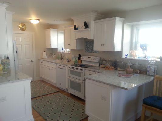 Candlelight cabinetry, Cambria quartz tops.