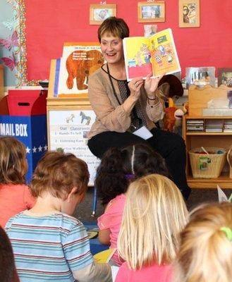 A Read Aloud Program volunteer shares her love of reading with a class of elementary school students.