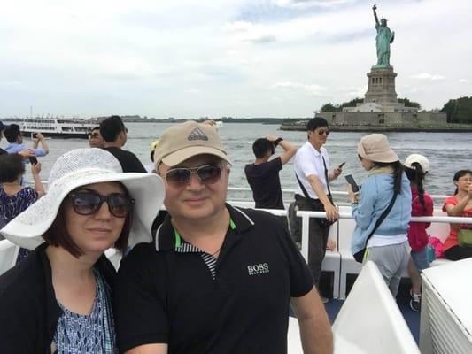 In front of Statue of Liberty, New York
 http://www.masterstravelgroup.com/destination.php?ID=64