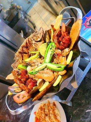 Carnaval De Mariscos.  Shrimp, whole fried tilapia, bacon wrapped shrimp, clams & fish.