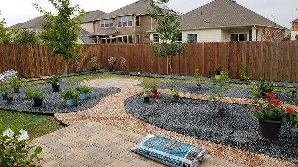 Completion of work before the plants go in. Taken from the stone deck by the back of the house.