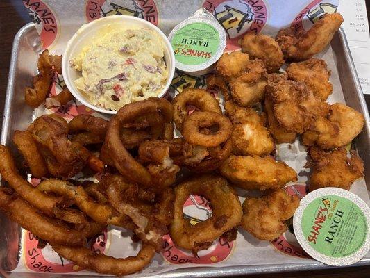 BONELESS WINGS with no sauce, potato salad, and Onion Rings.