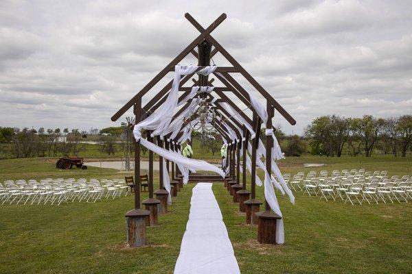 One of the outdoor ceremony spaces at Jones Barn at Willow Creek Ranch in Cleburne, TX by Mike Lewis Photography