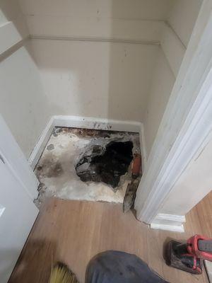 Water leak under concrete slab in hall closet