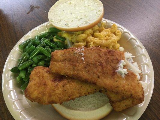 Fish sandwich with beans and Mac/Cheese.