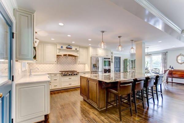 By removing some walls and installing a new beam, a tremendous amount of space was freed up to make this new kitchen very lar...