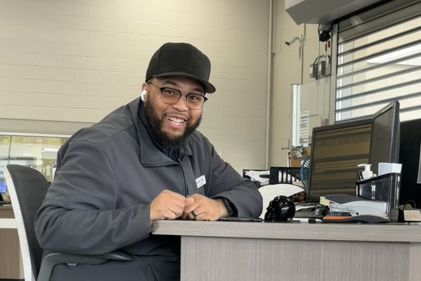 Service Advisor, Kenneth Hooper, at his desk in the service area