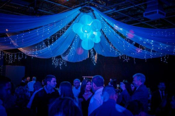 A super cool chandelier and draping as a centerpiece!