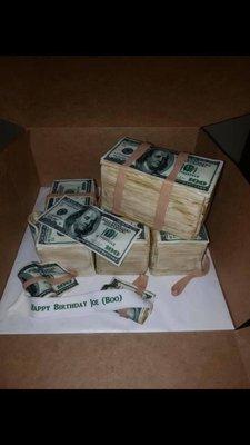 Money stacks cake