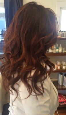 Sun kissed balyage with long layers and beach waves.