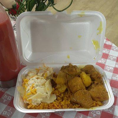 Curried chicken with rice and peas and potato salad toss with parmesan, asiago,  and Romano cheese.