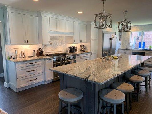 A client's kitchen: the perimeter is Kraftmaid Vantage, All Plywood Construction in their Sedona door style; painted maple in Dove White wit