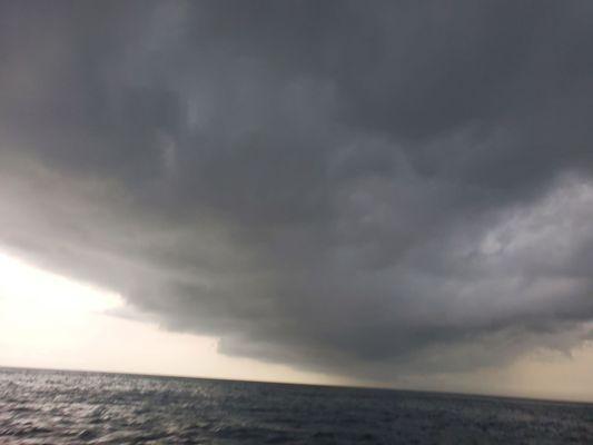 Huge storm that Captain Taylor drove around to get us a great fishing hole.