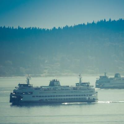 Two Washington State Ferries go across the Puget Sound.