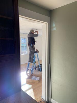 Tim setting up the center fixture for our dining room