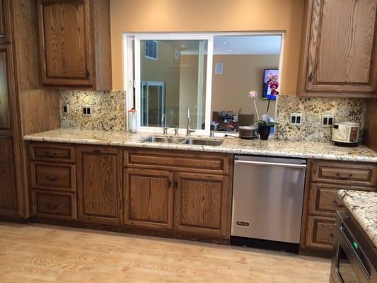 Custom cabinets with new stainless steel sink and Viking dishwasher