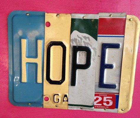 State Plate Signs from Hopewell, NJ upcycles license plates into many messages--can be custom ordered!