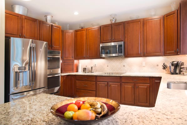 This is an after picture of a recent cabinet refinishing project.  We modified the existing layout, refinished the existing c...