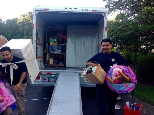 Our wonderful team unloading some toys, boxes, and furniture.