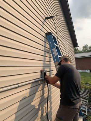 Mini-Split install for garage, lineset coming through wall and disconnect being installed.