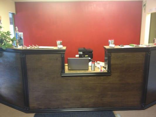 Front desk of Active Life chiropractic, built by the doctors.