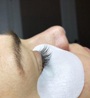 Side view of natural lashes before a Full Set of Eyelash Extensions is applied.