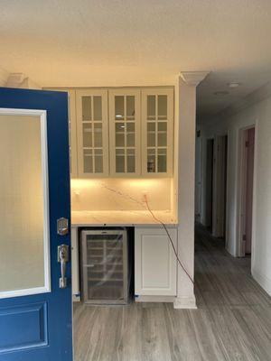 From coat closet to bar by JAS Construction Group