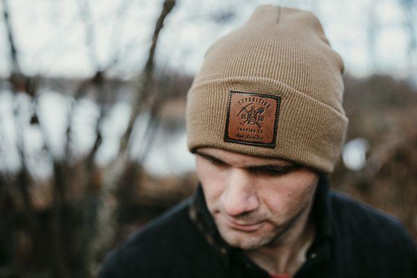 Leather patch beanies in many colors featuring our Expedition logo.