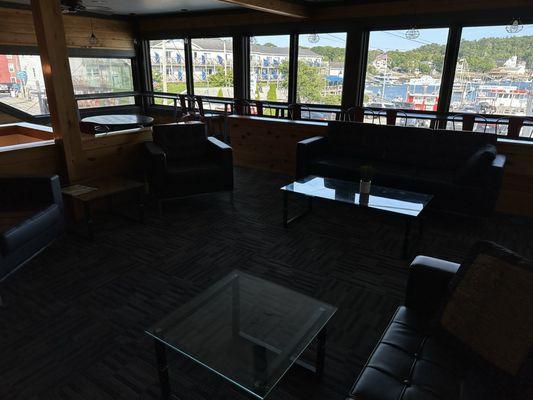 Huge upstairs lounge w/ water views. Perfect for business meetings, Zooms, or solo chill time.