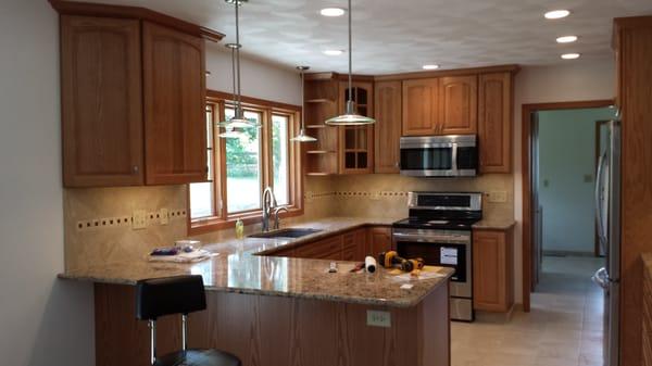 Cabinets, Cambria quartz countertops and tile backsplash