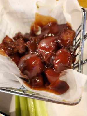 Peak in mini basket of Boneless Chicken Bites $10  tossed in their sweet heat sauce.  6/3/2023