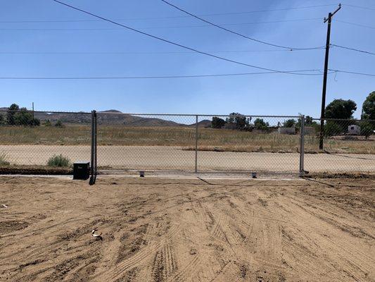 Welded chain link fence with gate operator