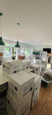 Full house packing, loading and delivery with furniture reassembly and debris removal.