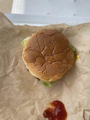 Cheeseburger with lettuce, tomato, and mayo.