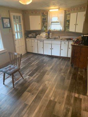 New flooring in kitchen into dining room.