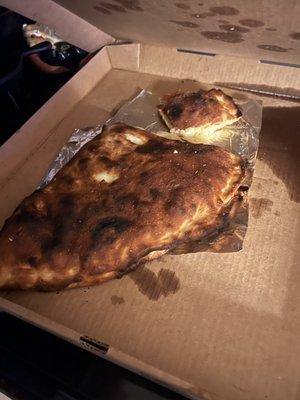 The calzone is over cooked almost burnt.