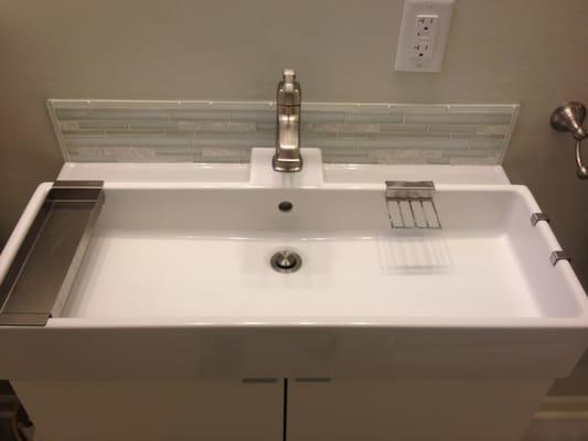 Vanity and top with tile backsplash accent.