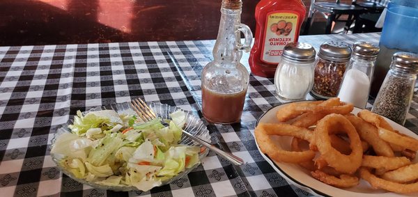 Salad with homemade dressing and onion rings