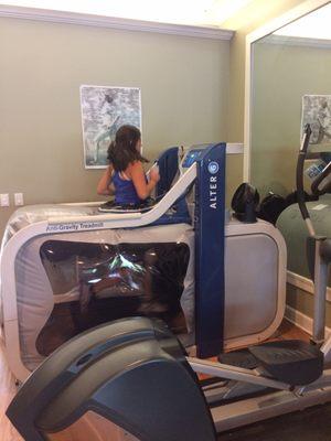 My daughter running on the Alter G anti-gravity treadmill.  Allows her to train during re-hab.