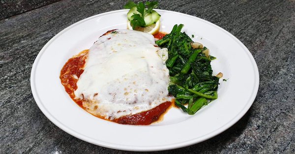 Veal Parmigiana with broccoli rabe