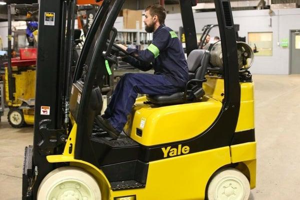 Certified Technician Driving A Yale Forklift In Indianapolis, IN.