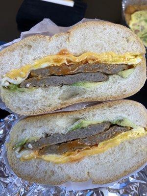 Sausage egg and cheese on a roll with avocado