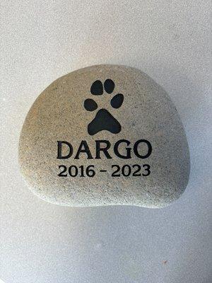 Pet stone memorial with an outline of Dargo's actual paw print.