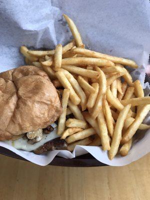 Delicious juicy perfectly prepared hamburger and fries