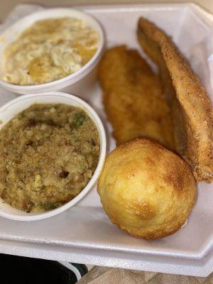 Catfish dinner with dressing, mac&cheese, and cornbread muffin.