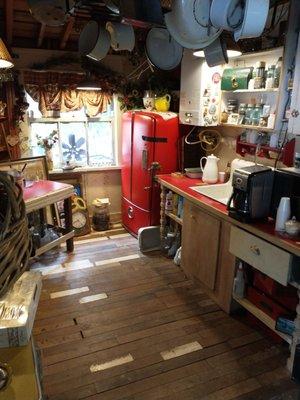 Kitchen themed room with 50's fridge, antique pots and pans