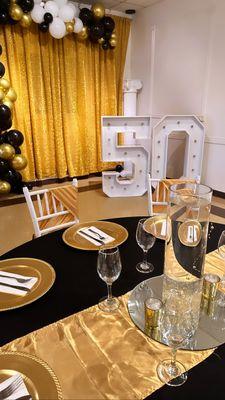 Black and Gold 50th Birthday Party Decoration at Crystal Reception Hall.