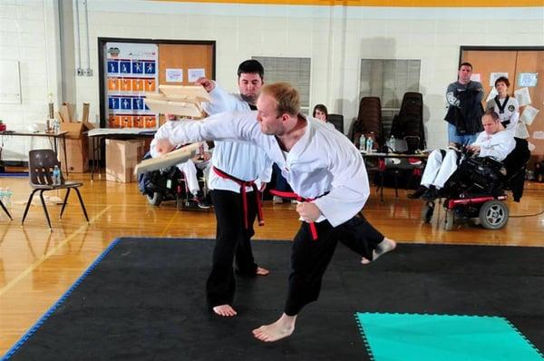 Here Adam shows the strength of a superman punch, 3 - 12" boards in a Speed Break (holder using only one hand) This Super Hum...