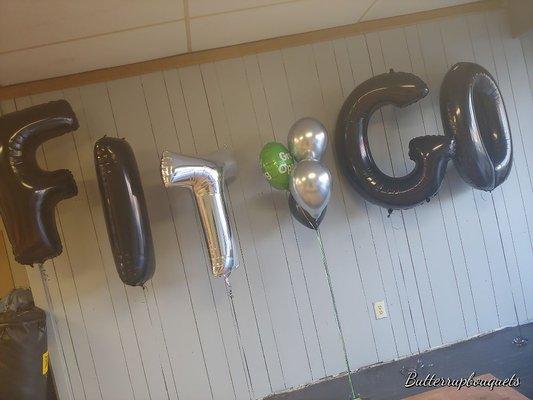 Grand Opening of an company "Fit Go", displayed in 40" Mylar balloons.