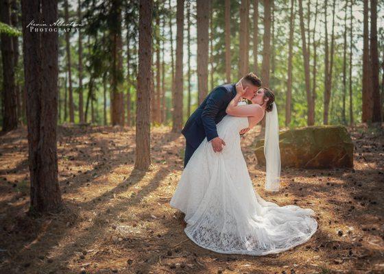 The kiss.  A lovely couple on their wedding day.